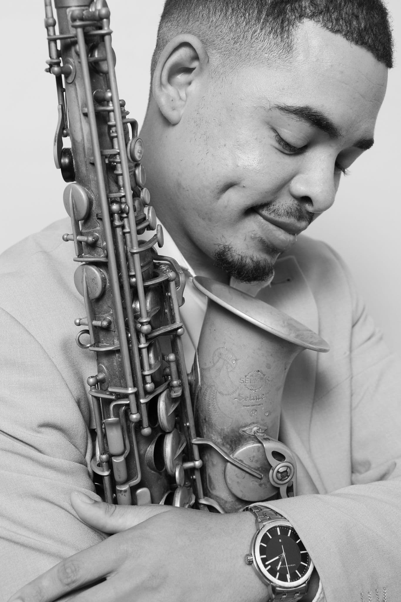 Ryan Hendricks — cheek resting on saxophone